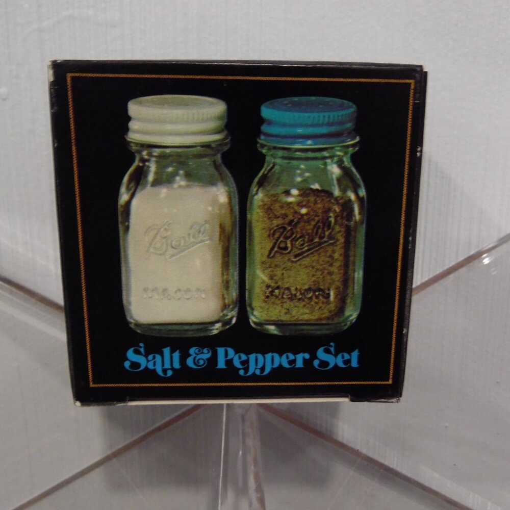 Salt And Pepper shakers--glass with metal lids in the shape of Ball Canning jars